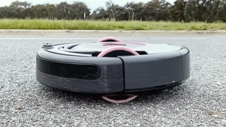 Testing a Roomba on a road modified with bigger wheels and other parts