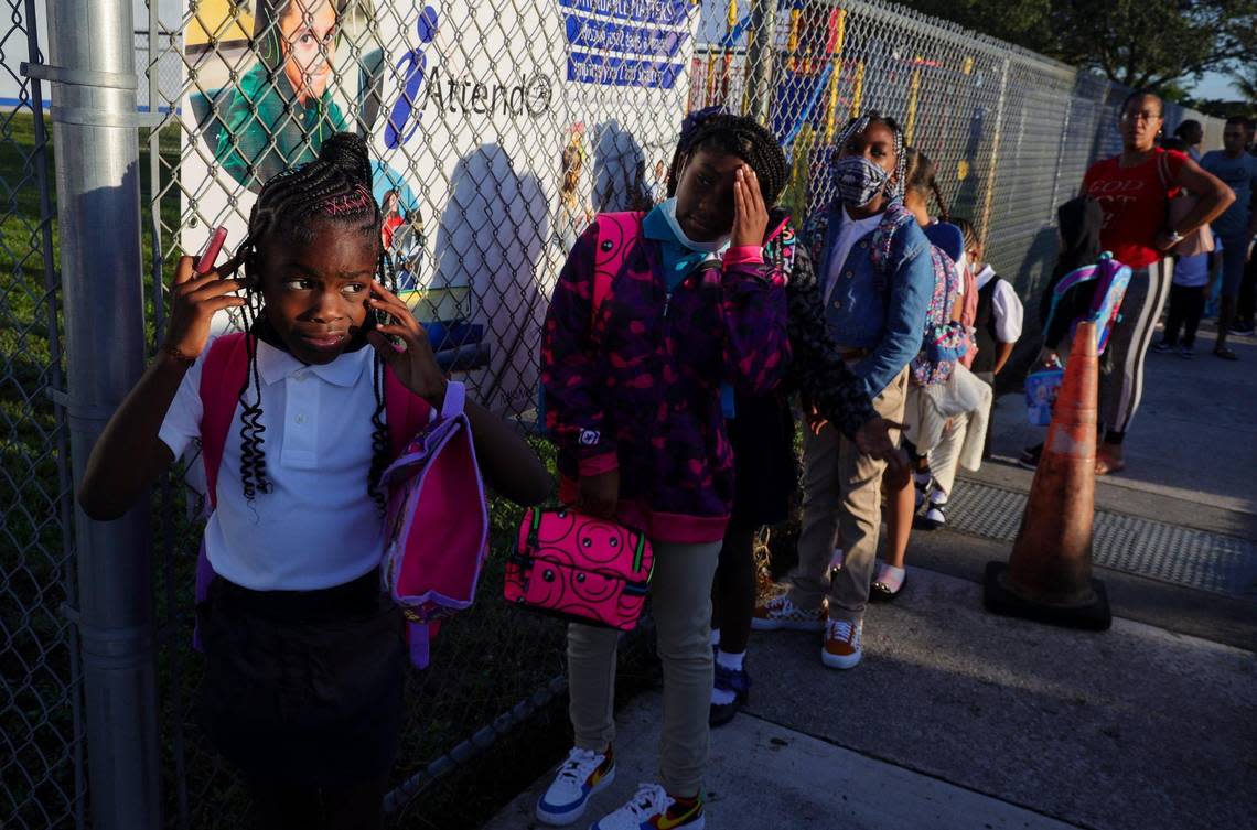 On Wednesday, Aug. 17, 2022, parents of Pre-K to fifth grade students wait to be let into school in the early-morning hours at Miami Gardens Elementary School. Wednesday was the first day of classes.