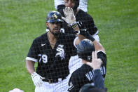 Chicago White Sox's Jose Abreu (79) high-fives Andrew Vaughn, right, after hitting a two-run home run during the fifth inning of the second baseball game of a doubleheader against the Baltimore Orioles, Saturday, May 29, 2021, in Chicago. (AP Photo/Matt Marton)