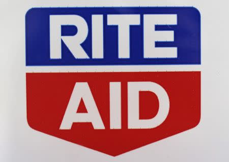 FILE PHOTO: A Rite Aid logo is seen outside one of their stores in New York, April 11, 2013. REUTERS/Shannon Stapleton