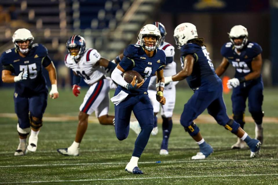 FIU quarterback Grayson James (3) runs on a keeper to score a touchdown during the first half of the Shula Bowl gainst FAU at Riccardo Silva Stadium in Miami, Florida, on Saturday, November 12, 2022.