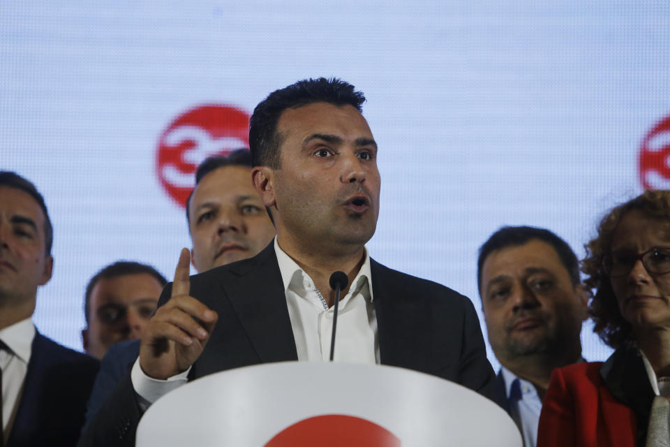 Macedonia's Prime Minister Zoran Zaev talks to members of the media during a news conference about the referendum in Skopje, Macedonia, late Sunday, Sept. 30, 2018. Zaev has described the crucial referendum on changing the small European country's name to North Macedonia and thereby pave the way to NATO membership as a clear success, despite lower than hoped for voter turnout. Zaev said he had no intention of resigning as the "vast majority" of those who voted Sunday approved the name change. (AP Photo/Boris Grdanoski)