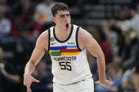 Minnesota Timberwolves center Luka Garza (55) reacts after scoring against the Utah Jazz during the second half of an NBA basketball game Wednesday, Feb. 8, 2023, in Salt Lake City. (AP Photo/Rick Bowmer)