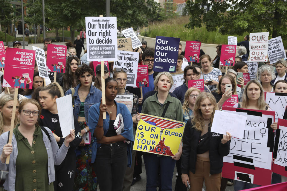 Demonstrators gather outside the United States embassy in Vauxhall to protest against the decision to scrap constitutional right to abortion, in London, Friday June 24, 2022. The Supreme Court has ended constitutional protections for abortion that had been in place nearly 50 years — a decision by its conservative majority to overturn the court's landmark abortion cases. Friday’s outcome overturning Roe v. Wade is expected to lead to abortion bans in roughly half the states. (Ashlee Ruggels/PA via AP)