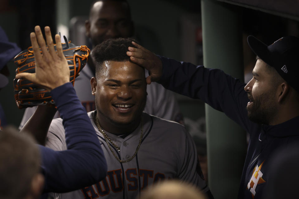 Houston Astros starting pitcher Framber Valdez celebrates in the dugout after the eighth inning in Game 5 of baseball's American League Championship Series against the Boston Red Sox Wednesday, Oct. 20, 2021, in Boston. (AP Photo/Winslow Townson)