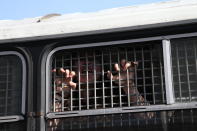 <p>A detained opposition activist shout anti-Putin slogans from police bus during the demonstration against President Vladimir Putin at Pushkin Square May 5, 2018 in Moscow, Russia. (Photo: Mikhail Svetlov/Getty Images) </p>