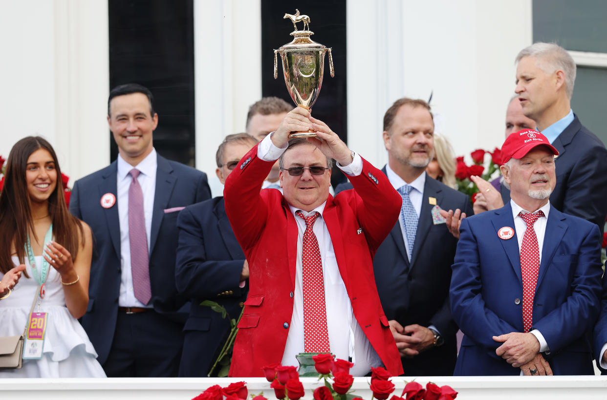 LOUISVILLE, KENTUCKY - MAY 07: Trainer Eric Reed holds the trophy after Rich Strike won the 148th running of the Kentucky Derby at Churchill Downs on May 07, 2022 in Louisville, Kentucky. (Photo by Jamie Squire/Getty Images)