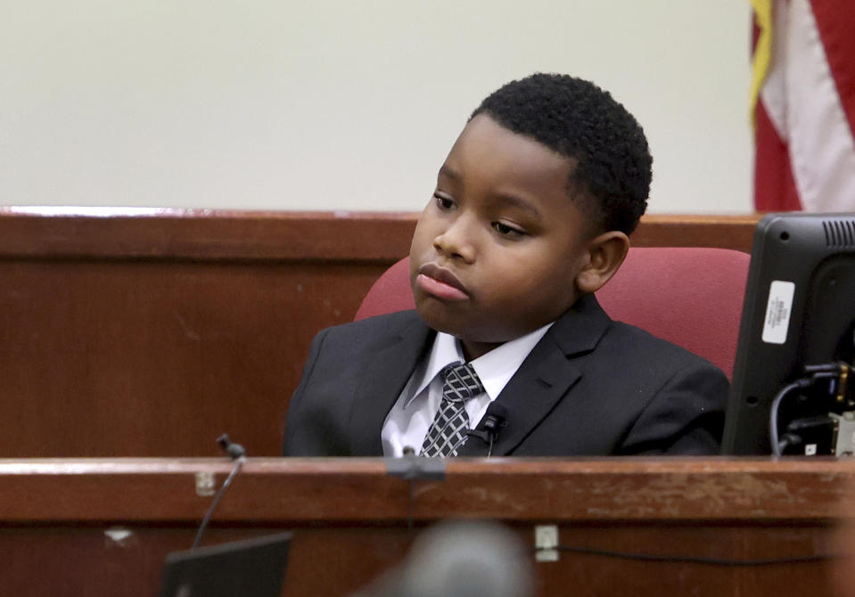 Zion Carr, 11, testifies during the murder trial of former Fort Worth Police Officer Aaron Dean on Monday, Dec. 5, 2022, in Fort Worth, Texas. Carr is Atatiana Jefferson's nephew and was present when she was shot and killed by Dean through a windown in her own Fort Worth home in 2019. (Amanda McCoy/Star-Telegram via AP, Pool)