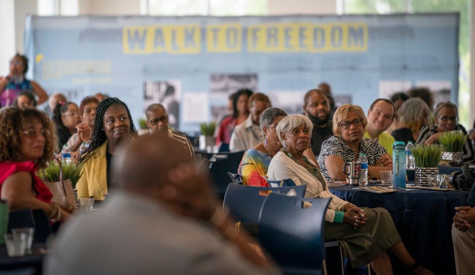 Attendees listen to a panel during the Freedom Walk Summit Thursday, June 22, 2023, at the Wayne County Community College District-Northwest Campus in the Denise Wellons-Glover Welcome Center.