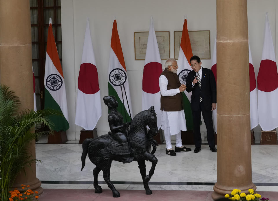 Indian Prime Minister Narendra Modi, left, talks with his Japanese counterpart Fumio Kishida before their delegation level meeting in New Delhi, India, Monday, March 20, 2023. (AP Photo/Manish Swarup)