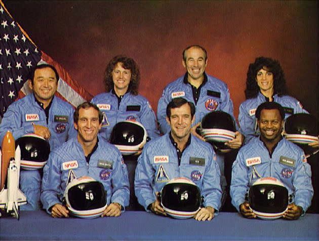 Space Shuttle Challenger crew members (back, L-R) Mission Specialist Ellison S. Onizuka, Teacher-in-Space participant Sharon Christa McAuliffe, Payload Specialist Greg Jarvis and mission specialist Judy Resnick. (Front, L-R) Pilot Mike Smith, commander Dick Scobee and mission specialist Ron McNair. (Photo: NASA via Getty Images)