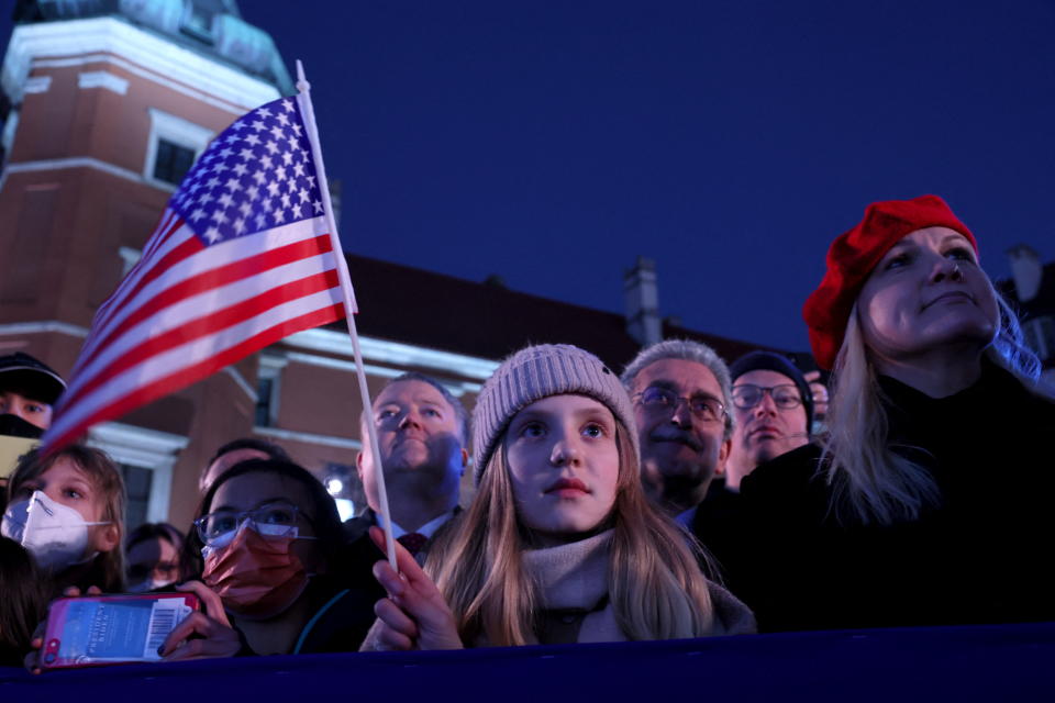 People listen as U.S. President Joe Biden speaks during an event at the Royal Castle, amid Russia's invasion of Ukraine, in Warsaw, Poland March 26, 2022. REUTERS/Evelyn Hockstein