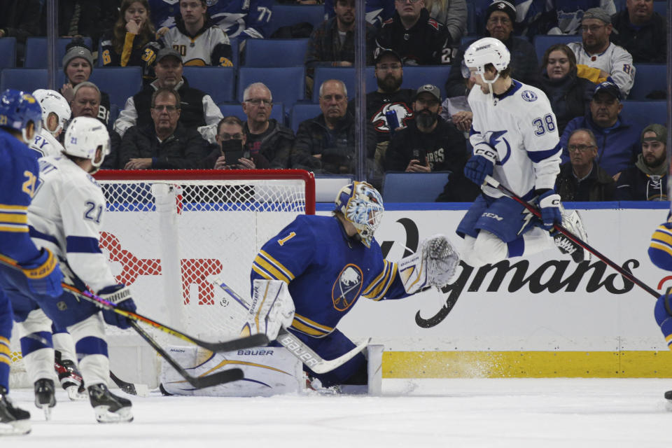 Tampa Bay Lightning left wing Brandon Hagel (38) scores a goal around Buffalo Sabres goaltender Ukko-Pekka Luukkonen (1) on a deflection during the third period of an NHL hockey game Monday, Nov. 28, 2022, in Buffalo, N.Y. (AP Photo/Joshua Bessex)