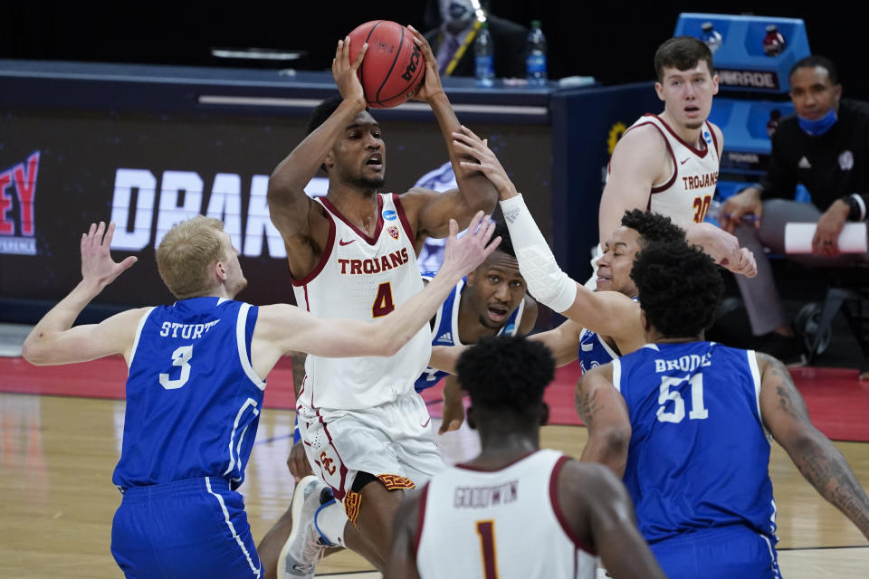 USC forward Evan Mobley (4) drives against Drake during the first half of a men's college basketball game in the first round of the NCAA tournament at Bankers Life Fieldhouse in Indianapolis, Saturday, March 20, 2021. (AP Photo/Paul Sancya)