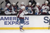 Colorado Avalanche defenseman Devon Toews is congratulated for his goal during the second period of the team's NHL hockey game against the Los Angeles Kings on Tuesday, Jan. 19, 2021, in Los Angeles. (AP Photo/Kyusung Gong)