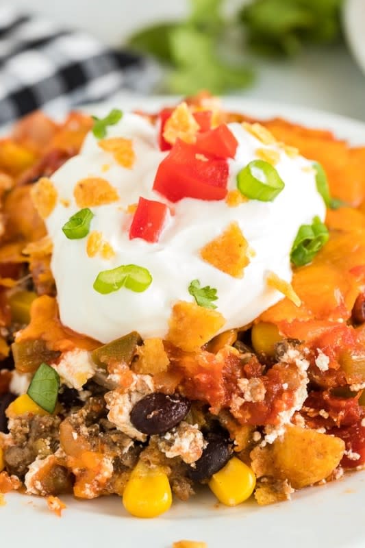 <p>Spaceships & Laserbeams</p><p>Hearty ground beef is baked with spices, chips and cheese then topped with cool sour cream for this amazing Mexican casserole. </p><p><strong>Get the recipe: </strong><a href="https://spaceshipsandlaserbeams.com/mexican-casserole/" rel="nofollow noopener" target="_blank" data-ylk="slk:Mexican Casserole;elm:context_link;itc:0;sec:content-canvas" class="link rapid-noclick-resp"><strong>Mexican Casserole</strong></a></p>