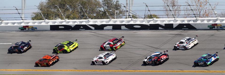 Racers work NASCAR Turn 3 this past weekend during the Weather Tech Championship Rolex 24 qualifying race at Daytona International Speedway. This weekend's Rolex 24 At Daytona endurance race is offering a boost to many Daytona Beach-area hoteliers.