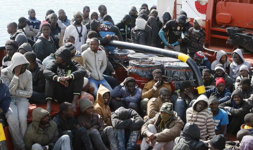 Migrants arrive by boat at the Sicilian harbour of Pozzallo
