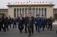 Delegates leave after a preparatory session of the National People's Congress outside the Great Hall of the People in Beijing, Monday, March 4, 2024. (AP Photo/Ng Han Guan)