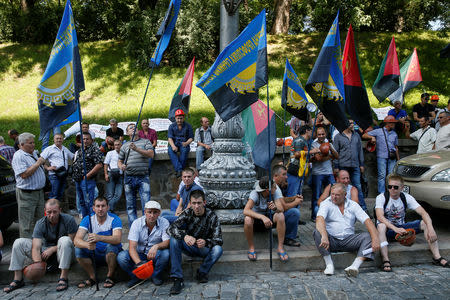 Miners of the Pervomaiska coal mine hold a rally demanding their due wages in a front of the government building in Kiev, Ukraine August 3, 2018. Picture taken August 3, 2018. REUTERS/Valentyn Ogirenko