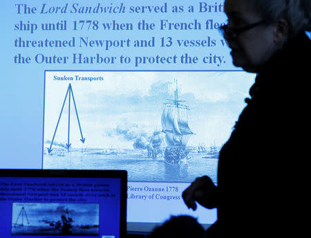 Dr. Kathy Abbass, executive director of the Rhode Island Marine Archeology Project, speaks in Providence, Rhode Island in front of a drawing of Captain James Cook's ship the Endeavour, renamed the Lord Sandwich, in Newport Harbor as she announces that her organization believes it has found the wreck of the ship, May 4, 2016. REUTERS/Brian Snyder