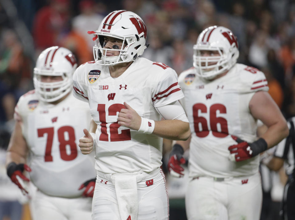 Wisconsin quarterback Alex Hornibrook (12) threw four scores in Wisconsin’s 34-24 win. (AP Photo/Lynne Sladky)