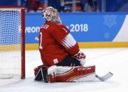 Ice Hockey - Pyeongchang 2018 Winter Olympics - Men's Playoff Match - Switzerland v Germany - Gangneung Hockey Centre, Gangneung, South Korea - February 20, 2018 - Goalie Jonas Hiller of Switzerland reacts after loosing a match. REUTERS/Brian Snyder