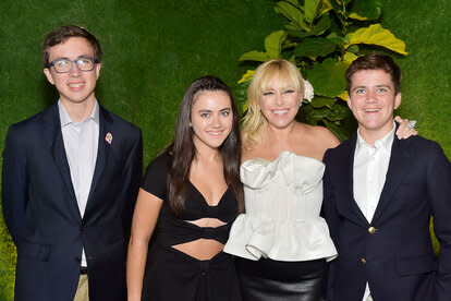 Sutton Stracke poses for a photo with her two sons and daughter