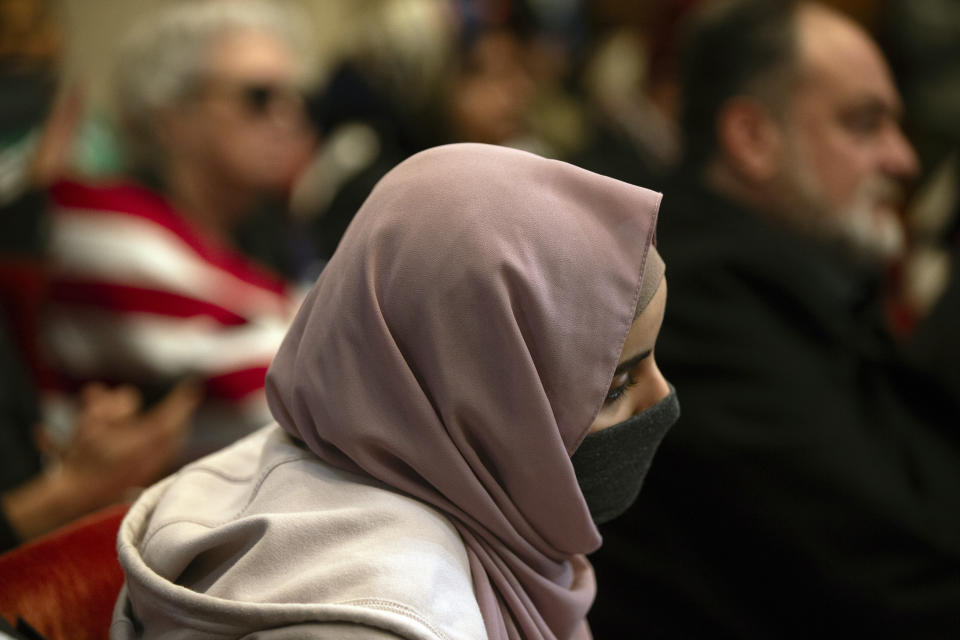 Audience members listen to public comment on a resolution from the Oakland City Council calling for an immediate cease-fire in Gaza, Monday, Nov. 27, 2023, in Oakland, Calif. (AP Photo/D. Ross Cameron)