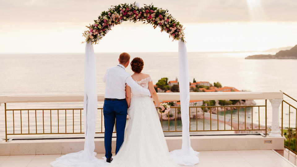 destination wedding couple at altar