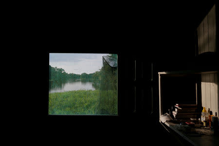 FILE PHOTO: A window of the floating research base of the Mamiraua Institute looks out at the Mamiraua Sustainable Development Reserve in Uarini, Amazonas state, Brazil, February 27, 2018. REUTERS/Bruno Kelly/File Photo