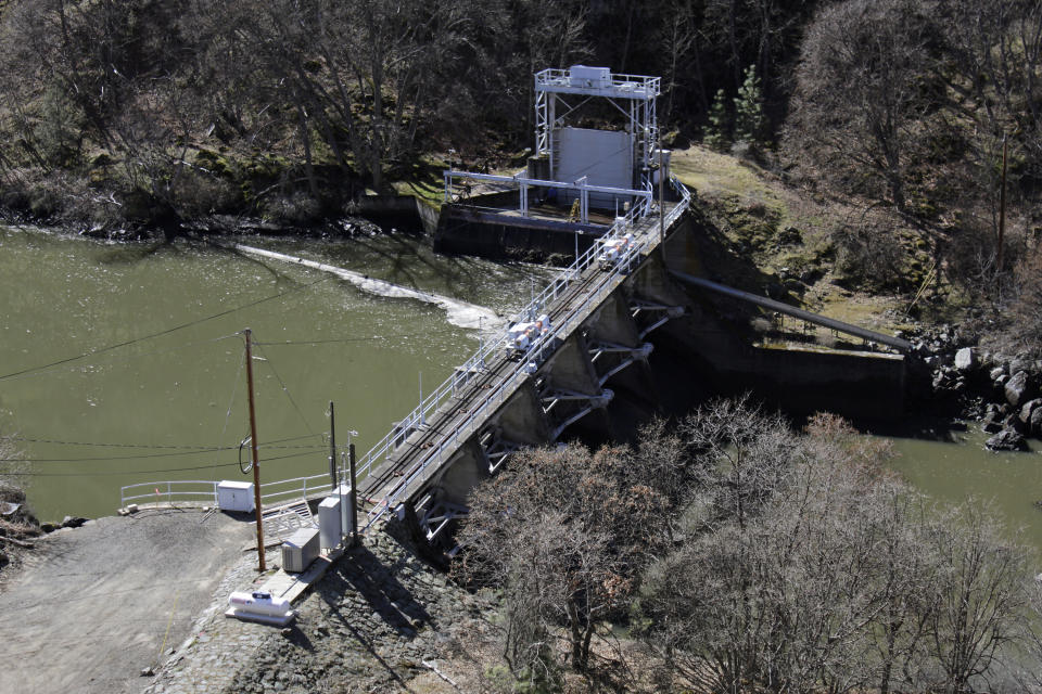 FILE - In this March 3, 2020, file photo, a dam on the Lower Klamath River known as Copco 2 is seen near Hornbrook, Calif. California Gov. Gavin Newsom has appealed directly to investor Warren Buffet to support demolishing four hydroelectric dams on a river along the Oregon-California border to save salmon populations that have dwindled to almost nothing. Newsom on Wednesday, July 28, 2020, wrote Buffet, urging him to back the Klamath River project, which would be the largest dam removal in U.S. history. (AP Photo/Gillian Flaccus, File)