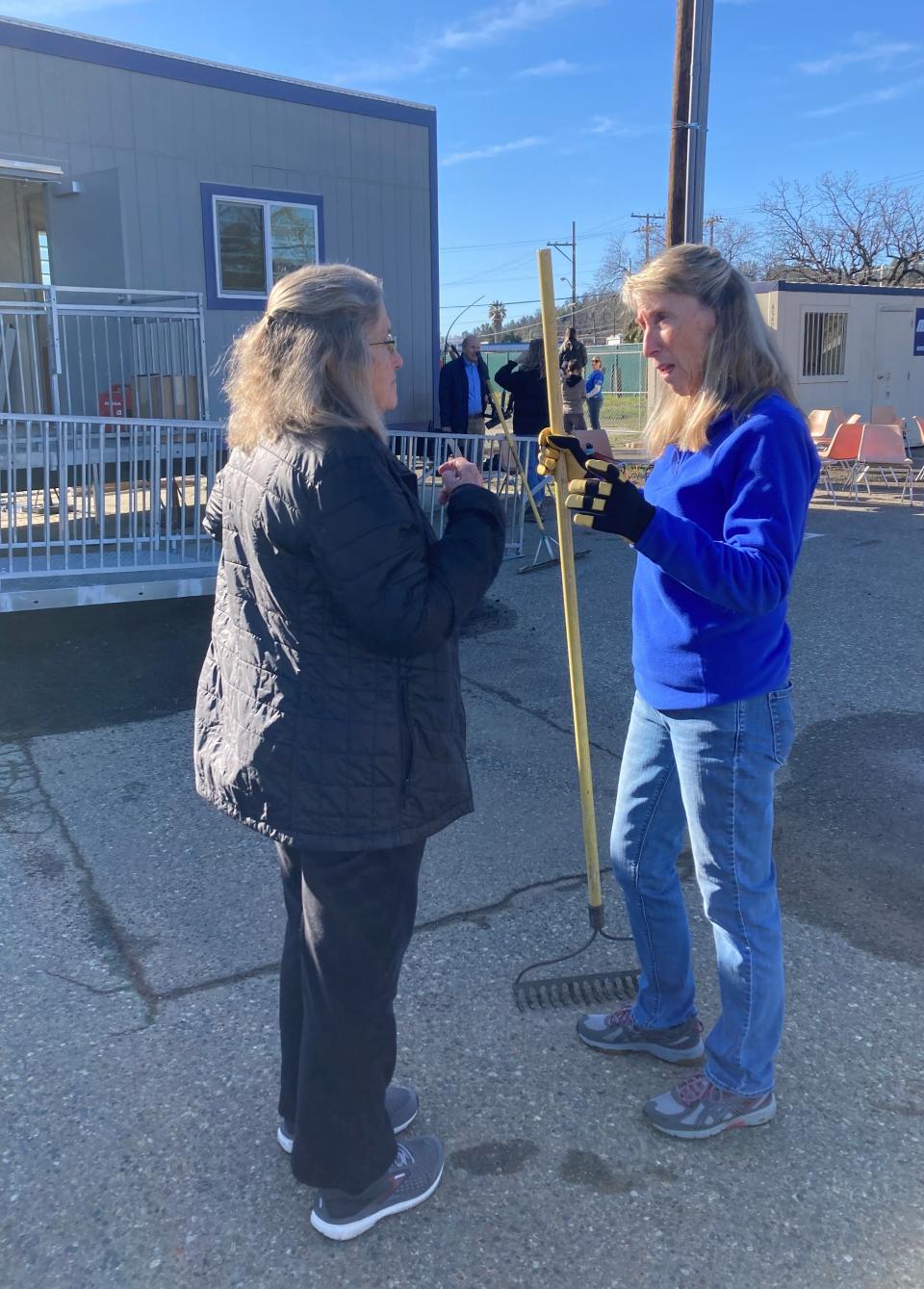 Laural Park, right, talks to Cindy LaFrance at the Mark Street micro-shelter site on Monday, Feb. 6, 2023.