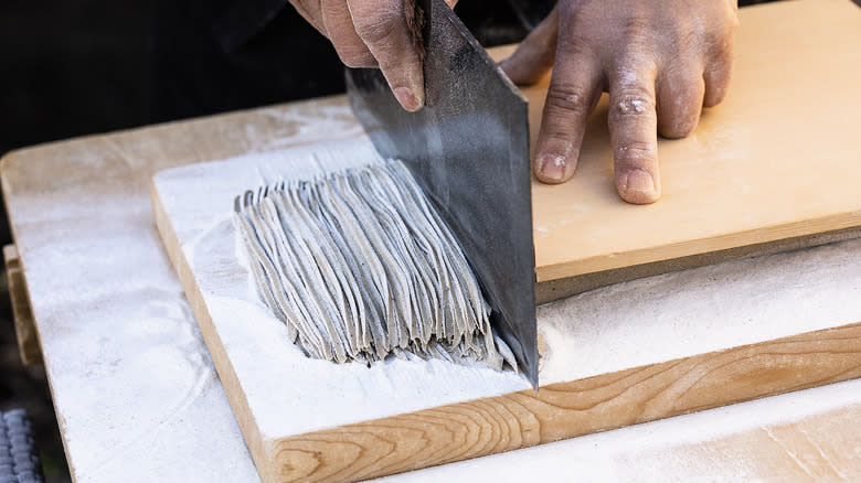 Cutting fresh soba noodles