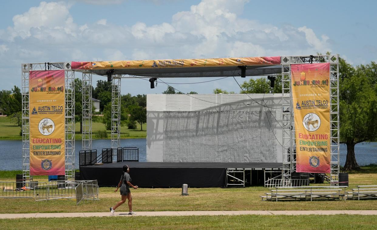 The stage remains at Old Settlers Park in Round Rock on June 17 after two people were killed two nights before in a shooting during a Juneteenth celebration. On Friday, police charged one suspect with two counts of murder.