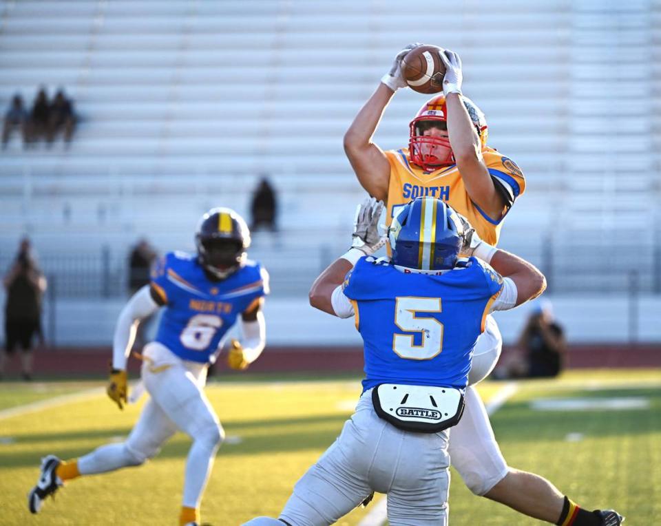 South team receiver Mick Merzon (Oakdale) makes a catch with coverage from the North’s Joe Cowan (Linden) during the Central California Lions All-Star Football Game at Tracy High School in Tracy, Calif., Saturday, June 24, 2023. The South won the game 38-13. Andy Alfaro/aalfaro@modbee.com