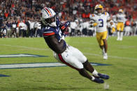 Auburn wide receiver Camden Brown (17) makes a catch for a touchdown as LSU safety Greg Brooks Jr. (3) defends in the first half of an NCAA college football game, Saturday, Oct. 1, 2022, in Auburn, Ala. (AP Photo/John Bazemore)