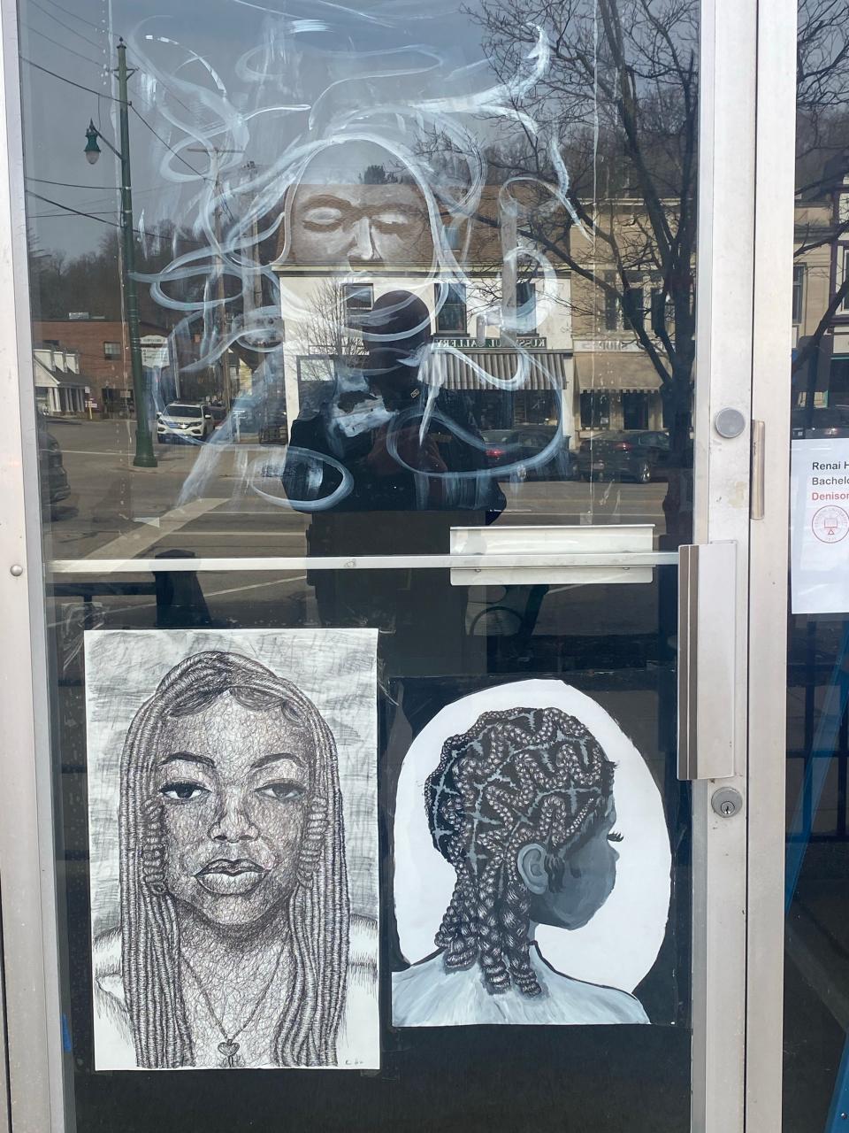 Artwork from Denison University junior Renai Heath is displayed at the door of Granville Village Hall.