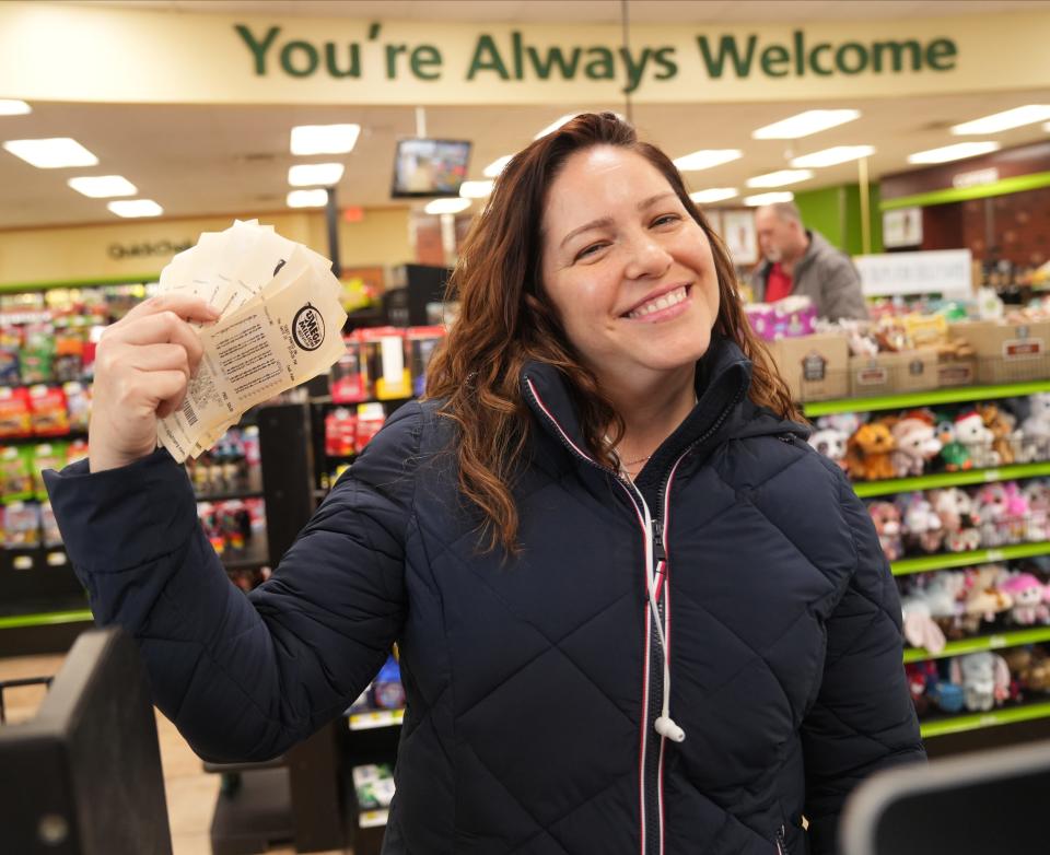 Jaime Rodriguez of Wayne holds 90 lottery tickets for Friday's $1.3 billion Mega Millions drawing. The tickets were purchased by Jaime for her co workers and herself at a Quick Chek in Wayne, NJ on January 12, 2023.