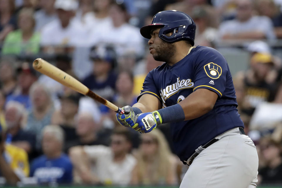 Milwaukee Brewers' Jesus Aguilar drives in a run with an RBI single off Pittsburgh Pirates starting pitcher Steven Brault during the fourth inning of a baseball game in Pittsburgh, Friday, July 5, 2019. (AP Photo/Gene J. Puskar)