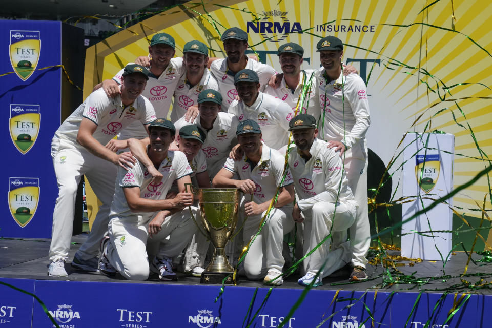 Australia's players pose with their trophy after winning on the fourth day of their cricket test against Pakistan match in Sydney, Saturday, Jan. 6, 2024. Australia also won the series 3-0. (AP Photo/Rick Rycroft)