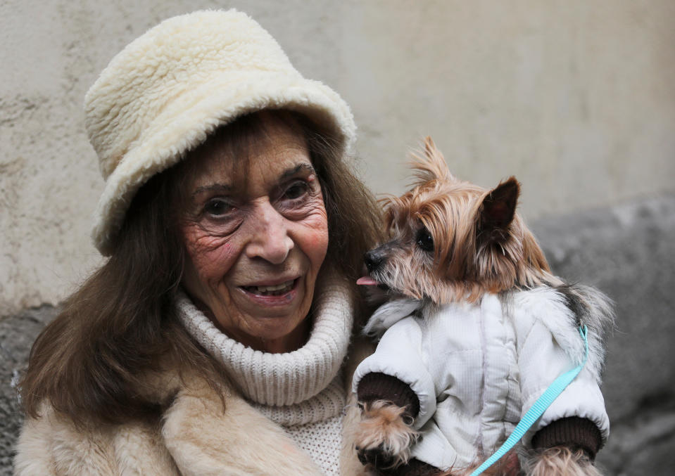 A dog licks her owner after being blessed by a priest as pet owners bring their animals to be blessed every year on the feast day of Spain’s patron saint of animals, Saint Anthony, outside San Anton church in Madrid, Jan. 17, 2019. (Photo: Sergio Perez/Reuters)