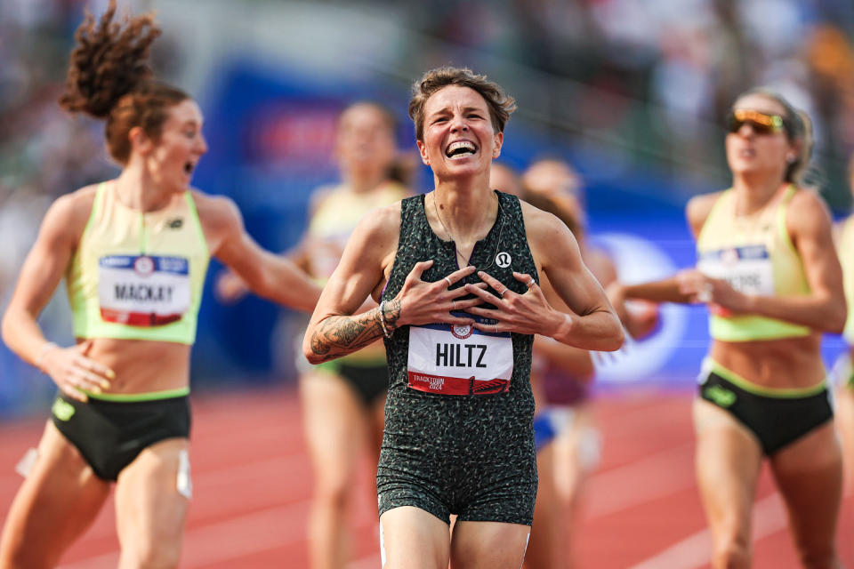Nikki Hiltz celebrates after crossing the finish line on the track (Patrick Smith / Getty Images)