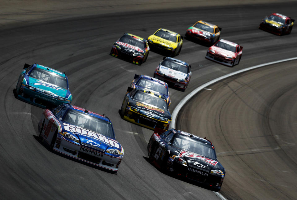 LAS VEGAS, NV - MARCH 11: Dale Earnhardt Jr., driver of the #88 National Guard/Diet Mountain Dew Chevrolet, and Kevin Harvick, driver of the #29 Budweiser Chevrolet, lead the field during the NASCAR Sprint Cup Series Kobalt Tools 400 at Las Vegas Motor Speedway on March 11, 2012 in Las Vegas, Nevada. (Photo by Todd Warshaw/Getty Images for NASCAR)