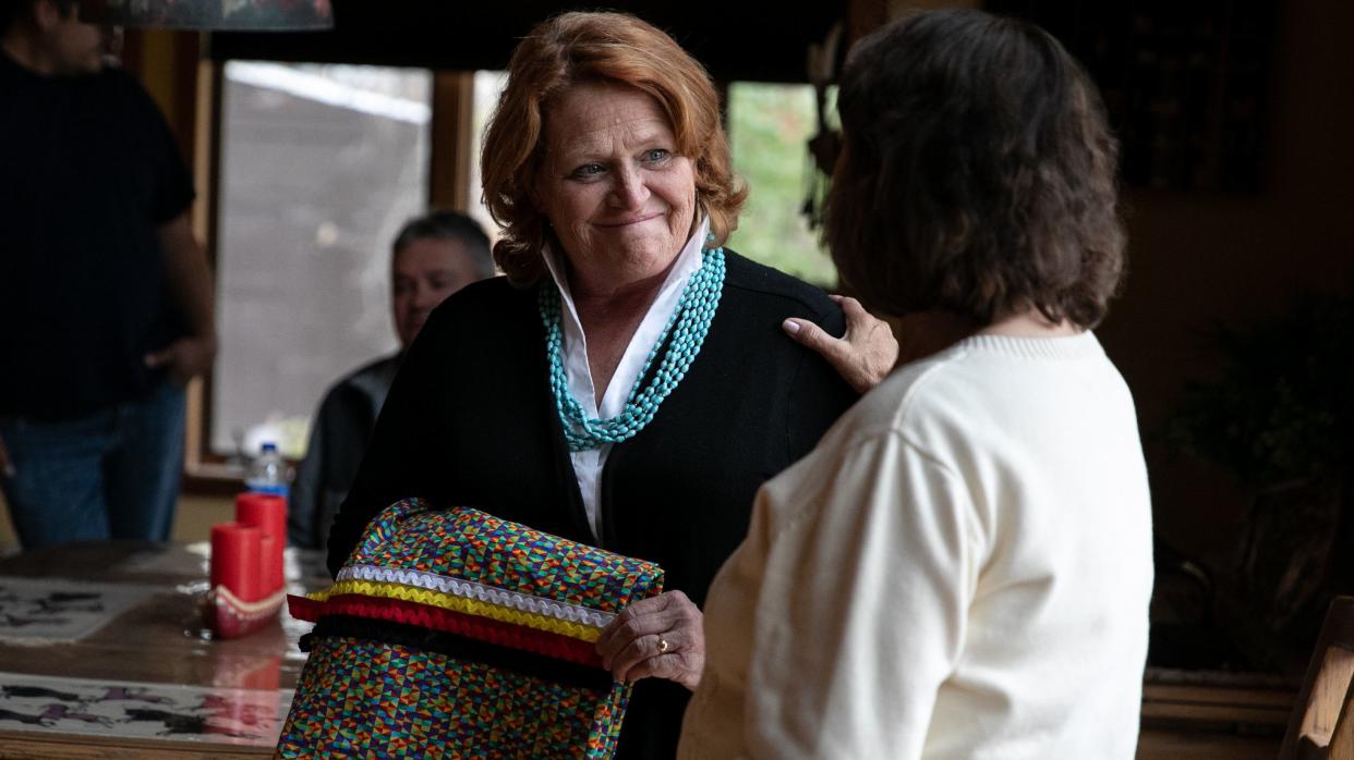 Sen. Heidi Heitkamp (D-N.D.),&nbsp;an underdog in her re-election bid, accepts a ribbon skirt at the home of Twila Martin-Kekahbah, a member of the Turtle Mountain Band of Chippewa. (Photo: Ilana Panich-Linsman for HuffPost)