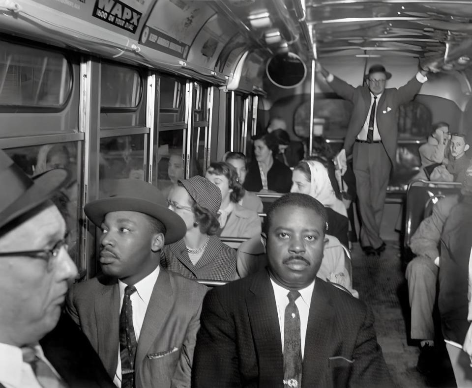 The Rev. Martin Luther King Jr., left, and the Rev. Ralph Abernathy ride the first desegregated buses in Montgomery, Alabama, on Dec. 21, 1956.