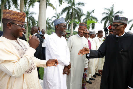 Nigeria's President Muhammadu Buhari is received by some state governors at at Nnamdi Azikiwe airport in Abuja, Nigeria August 19, 2017 after his return from three months medical trip in Britain. Nigeria Presidency/Handout via Reuters