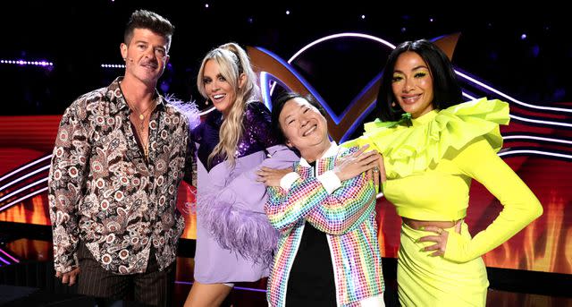 <p>FOX via Getty</p> Nicole Scherzinger with, from left, Robin Thicke, Jenny McCarthy and Ken Jeong on 'The Masked Singer' in 2022