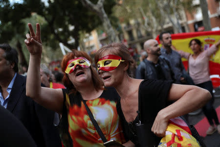 Protesters against a banned referendum on independence in Catalonia take part in a demonstration in Barcelona, Spain, September 22, 2017. REUTERS/Susana Vera