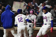 New York Mets' Brandon Nimmo (9) celebrates with Francisco Lindor (12) and other teammates after scoring a game-winning two-run home run during the ninth inning of a baseball game against the Atlanta Braves, Sunday, May 12, 2024, in New York. The Mets won 4-3. (AP Photo/Julia Nikhinson)